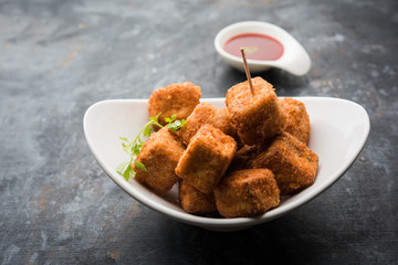 Crispy Paneer popcorn is a popular party snack and an appetiser. selective focus