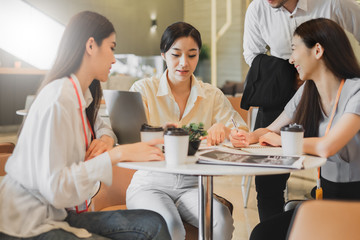 Group of Asian business people meeting in office