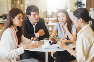 Group of Asian business people meeting in office