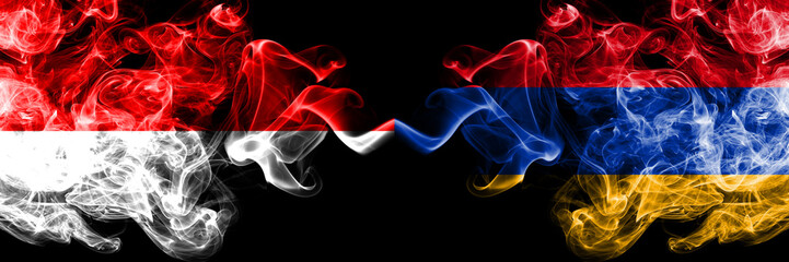 Indonesia vs Armenia, Armenian smoky mystic flags placed side by side. Thick colored silky smoke...