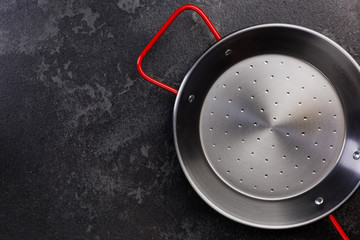 Steel Frying Pan, Top View, Dark Background with Copy Space