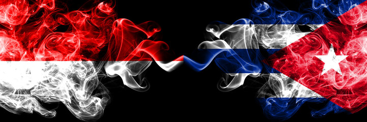 Indonesia vs Cuba, Cuban smoky mystic flags placed side by side. Thick colored silky smoke flags of Indonesia and Cuba, Cuban