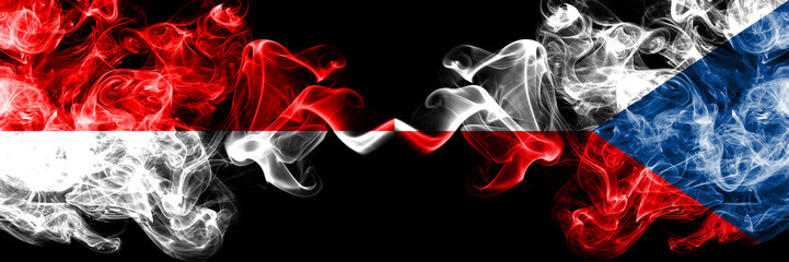 Indonesia vs Czech Republic smoky mystic flags placed side by side. Thick colored silky smoke flags of Indonesia and Czech Republic