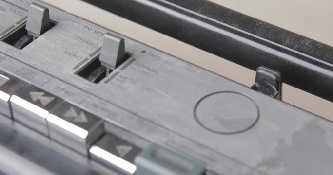 Switch to stereo on Retro stereo recrod player ghetto-blaster on the table / detail