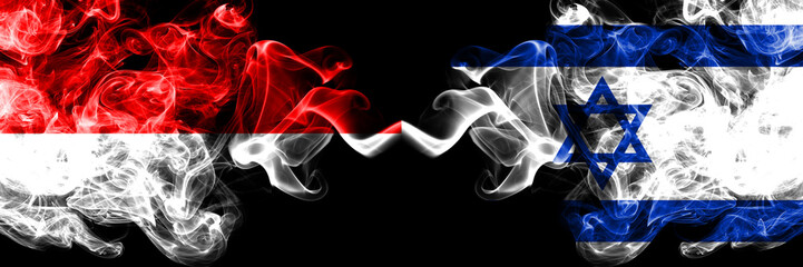 Indonesia vs Israel, Israeli smoky mystic flags placed side by side. Thick colored silky smoke flags of Indonesia and Israel, Israeli