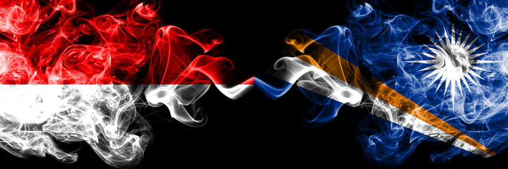 Indonesia vs Marshall Islands smoky mystic flags placed side by side. Thick colored silky smoke...