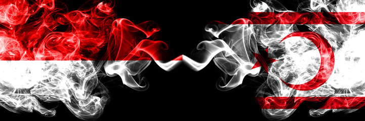 Indonesia vs Northern Cyprus smoky mystic flags placed side by side. Thick colored silky smoke flags of Indonesia and Northern Cyprus