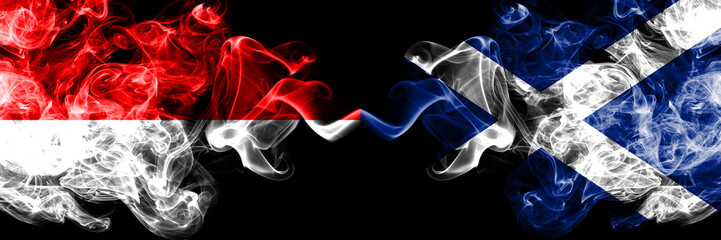 Indonesia vs Scotland, Scottish smoky mystic flags placed side by side. Thick colored silky smoke flags of Indonesia and Scotland, Scottish