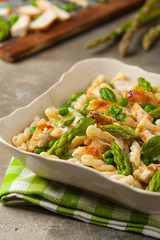 Italian pasta fusilli. Salad with chicken and asparagus in Béchamel sauce.