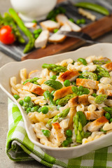 Italian pasta fusilli. Salad with chicken and asparagus in Béchamel sauce.