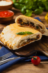Italian calzone with mushrooms and ham.