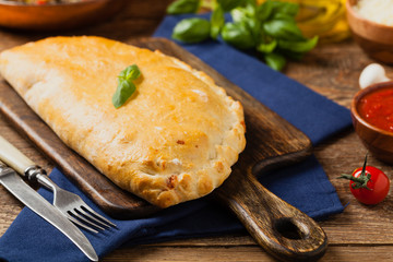 Italian calzone with mushrooms and ham.