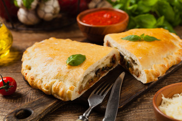 Italian calzone with mushrooms and ham.