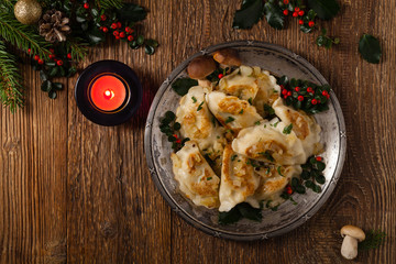 Traditional dumplings with cabbage and mushrooms. Christmas decoration.