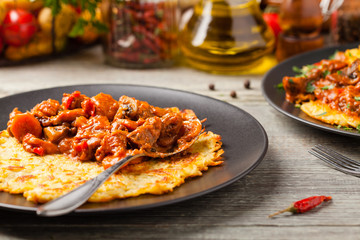 Hungarian potato pancake with goulash