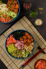 Hawaiian salmon poke bowl with seaweed, avocado, sesame seeds.