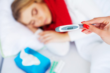 Fever And Cold. Portrait Of Beautiful Woman Caught Flu, Having Headache And High Temperature. Closeup Of Ill Girl Covered In Blanket, Feeling Sick Holding Thermometer