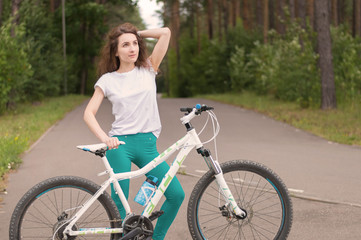 Obraz na płótnie Canvas young woman with bicycle