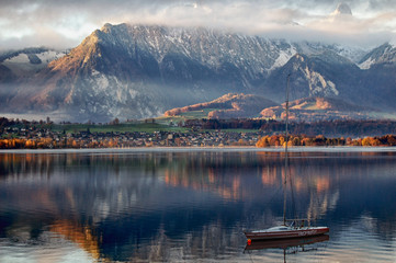 autumnal atmosphere at the Lake of Thoune with first snow