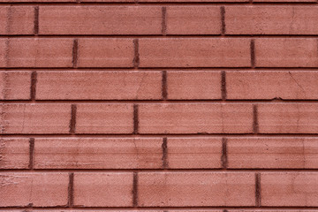 red brick wall with regular geometric structure close-up