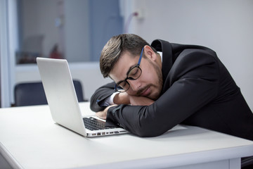 Tired business man sleeping in office