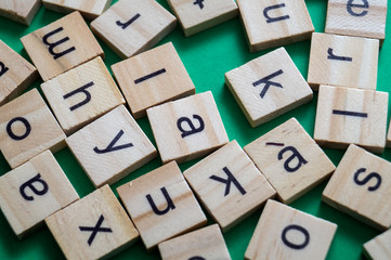 Alphabet letters on wooden scrabble pieces