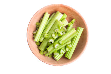 sliced celery in deep wooden bowl