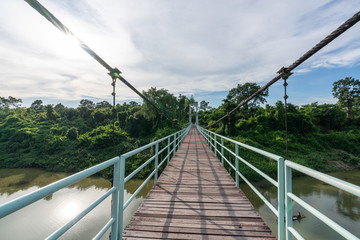 Obraz premium Beautiful of the longest suspension bridge in North eastern Region at Tana Rapids National Park,Ubonratchatani, Thailand