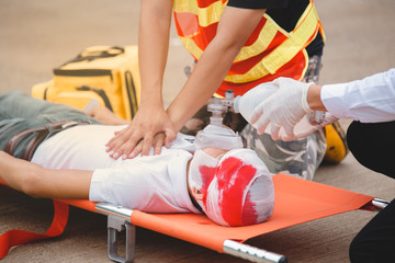 Obraz na płótnie Canvas rescuers team cpr for help man accident