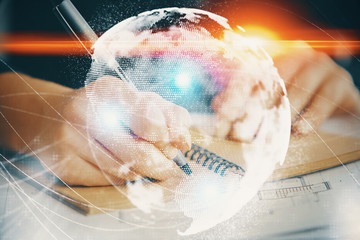 International business hologram over woman's hands taking notes background. Concept of success. Double exposure