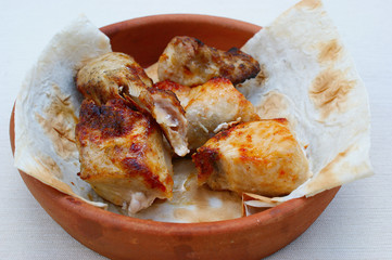 Georgian food. Grilled chicken on skewers (chicken shashlik). Popular dish of Georgian cuisine.