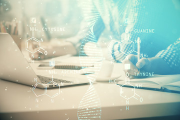 DNA hologram with businessman working on computer on background. Concept of bioengineering. Double...