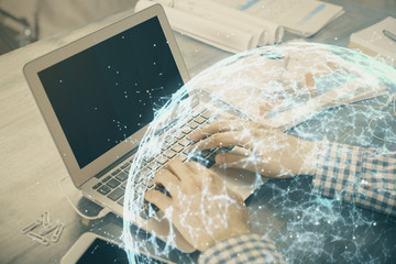 Social network theme hologram with businessman working on computer on background. Concept of world...