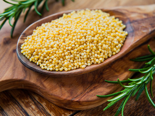 Millet on wooden spoon - macro.