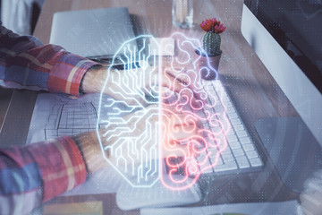 Man typing on keyboard background with brain hologram. Concept of big Data. Double exposure.
