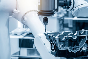 The automotive parts finishing process by milling spindle attach the robotic arm. The aluminium...