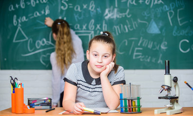 Bright minds at work. Little scientist work with microscope. Biology lesson. science experiments in...