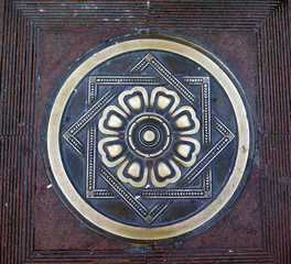 Metallic symbols on the ground
