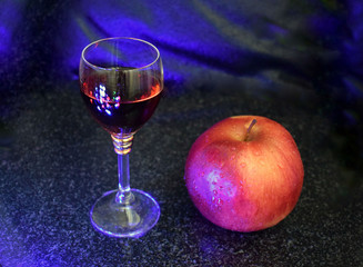 glass of wine and ripe Apple