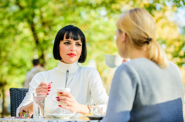 Conversation women cafe terrace. Friendship friendly relations. Revelation and support. Trustful communication. Friendship sisters. Friendship meeting. Closest people. Girls friends drink coffee talk