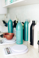 stylist's work with the hair of a girl in a beauty salon