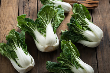 Bok choy or mini bok choy, Chinese Asian vegetables on wood