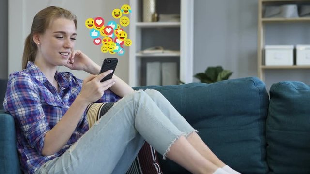 Young Woman Watching a Live Stream on Smartphone, Emoji and Likes