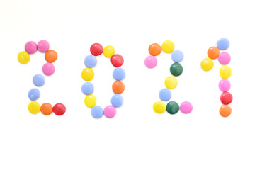 The number 2021 is made up of chocolate multicolored candies.