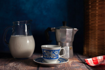 cup of coffee and milk jug