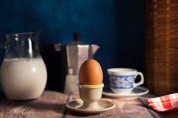 cooked  egg  in egg cup breakfast