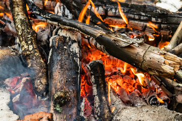 Dying bonfire. A fading bonfire. 
