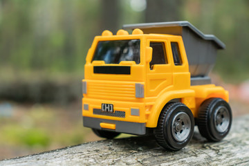 Truck toy with blurred backdrop.