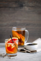 Refreshing healthy cocktail of fermented raw kombucha tea with a slice of grapefruit and ices with copy space for text.Kombucha mushroom tea is a natural fermented drink originally from China.