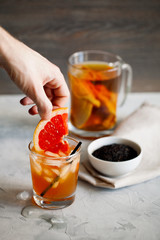 Refreshing healthy cocktail of fermented raw kombucha tea with a slice of grapefruit and ices.Kombucha mushroom tea is a natural fermented drink originally from China.Vertical orientation